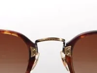 Lunettes de soleil Kossou, détail du pont doré